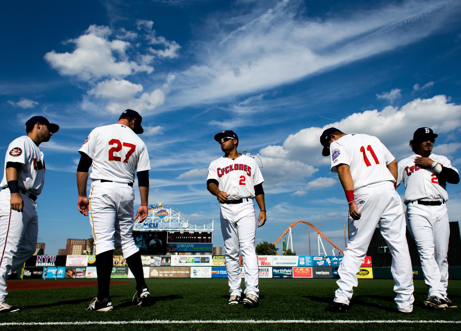 Members of the Brooklyn Cyclones stretching at their field in Brooklyn, New York. The Cyclones were the first professional baseball team to return to Brooklyn after the Dodgers left in 1958.