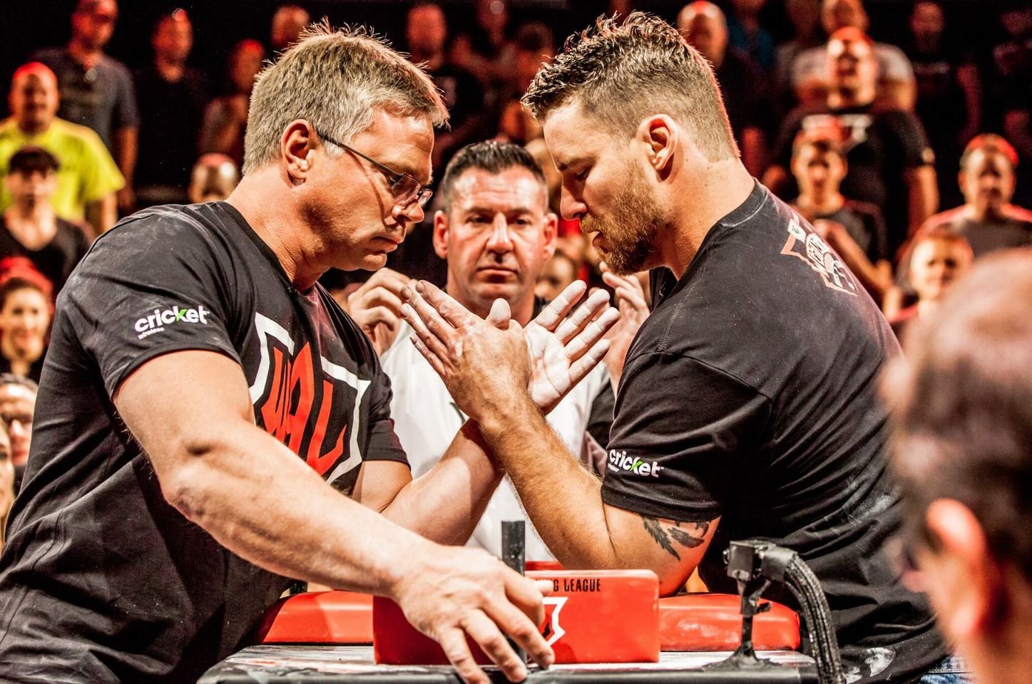 John Brzenk (left) set to lock wrists at a left-handed arm wrestling match in 2015. With hundreds of titles to his name, including 4 World Championships, Brzenk is the GOAT in organized arm wrestling.