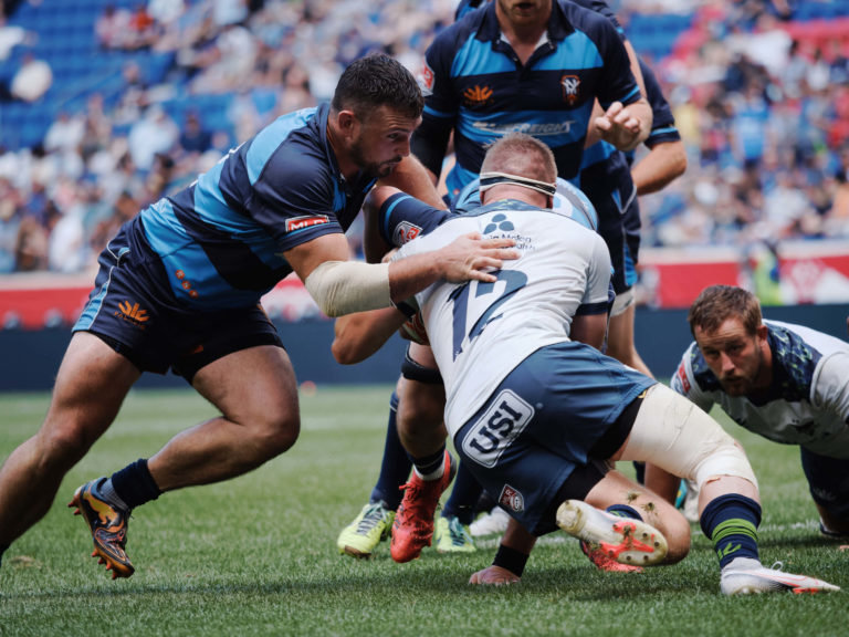 The New York Ironworkers (blue) in action against the Seattle Seawolves at the 2022 Major League Rugby Championship. It was MLR's 4th championship run as a professional league and New York's first title.