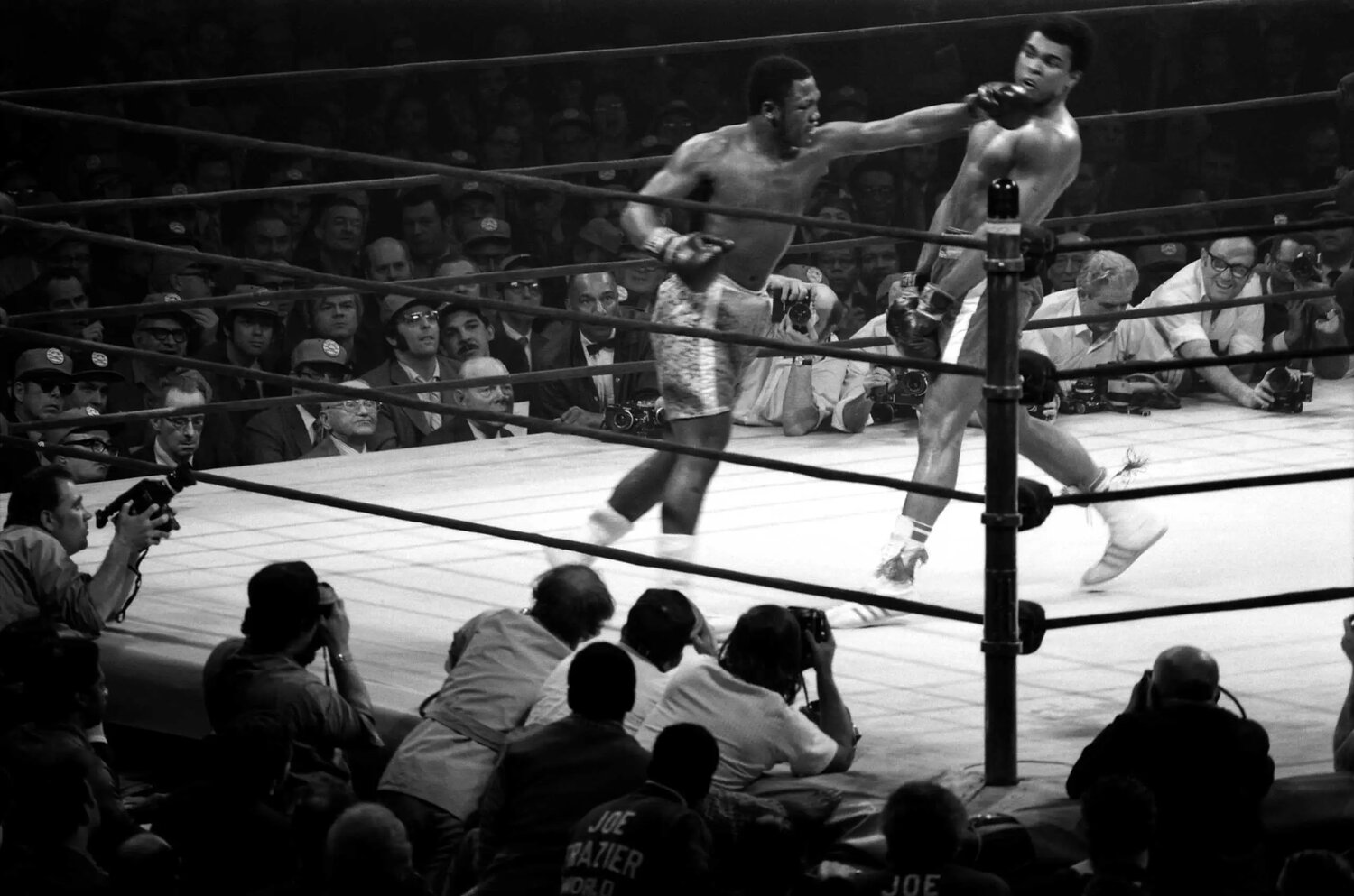Joe Frazier (left) and Muhammad Ali battling the 'Fight of the Century' at Madison Square Garden on March 8, 1971. The original boxing ring along with the posts and ropes is on display at the Boxing Hall of Fame.