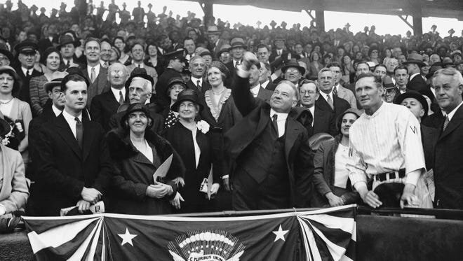 President Herbert Hoover throwing the ceremonial first pitch on April 14, 1931 in a game between the Washington Senators and Philadelphia Athletics. A lover of baseball, Hoover attended more MLB games than any other American President.